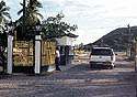 Gated main entrance and security office.